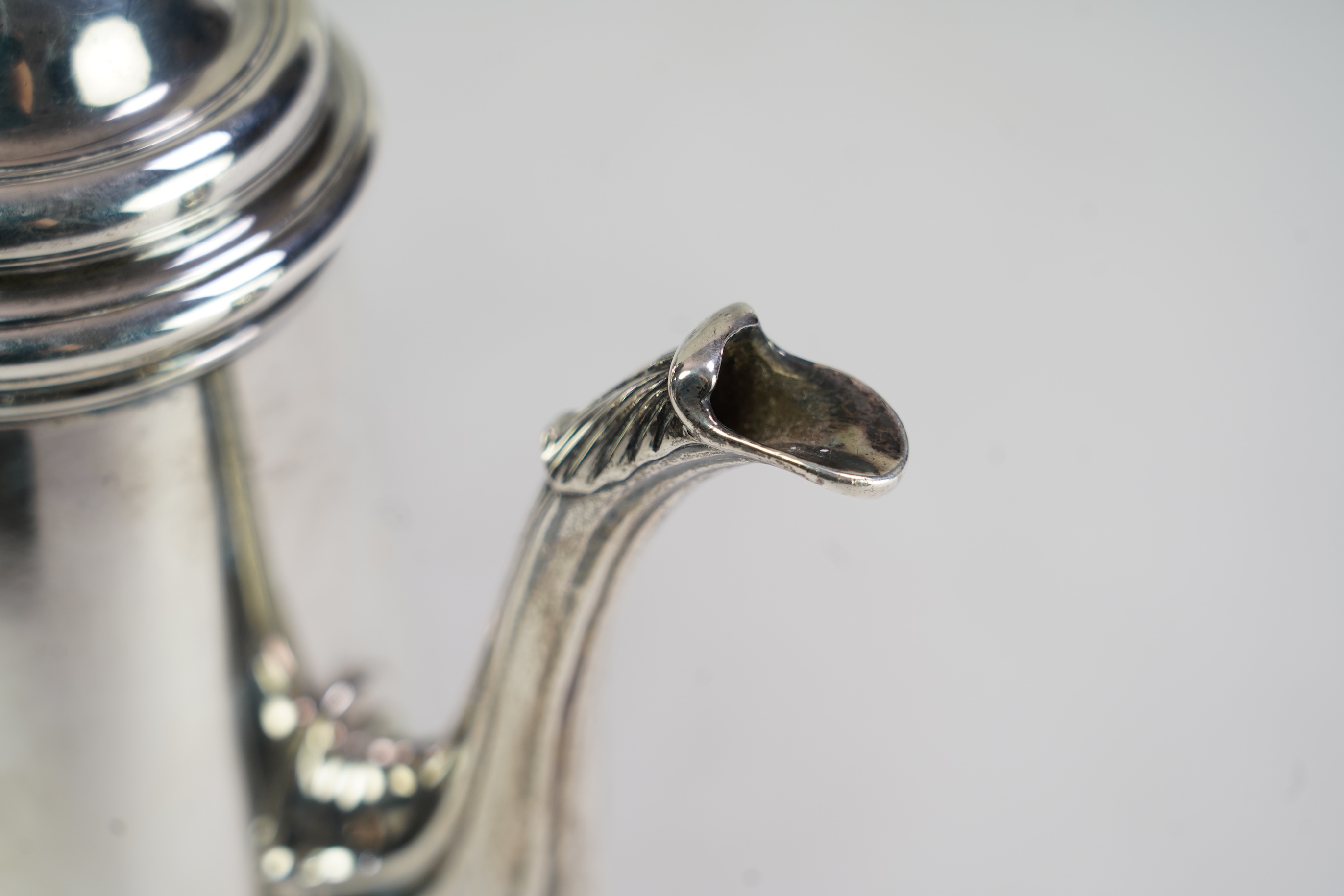 A mid 18th century silver coffee pot, marks very rubbed